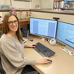 Becky_WIC Becky Smith working at desk